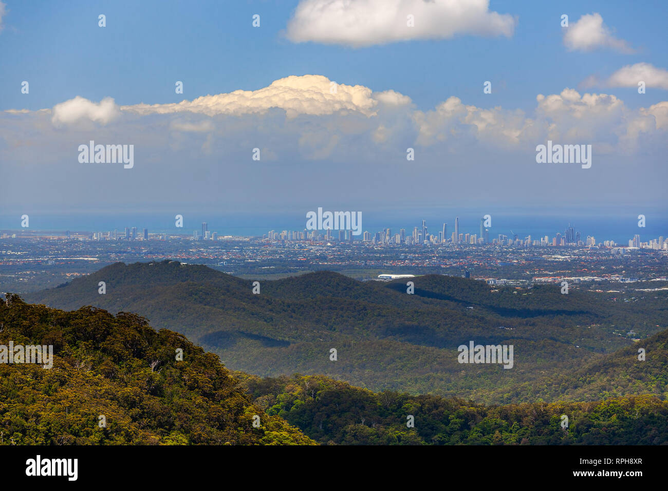 Panoramic view of Gold Coast city high rise and Springbrook National Park on bright sunny day. Queensland, Australia Stock Photo
