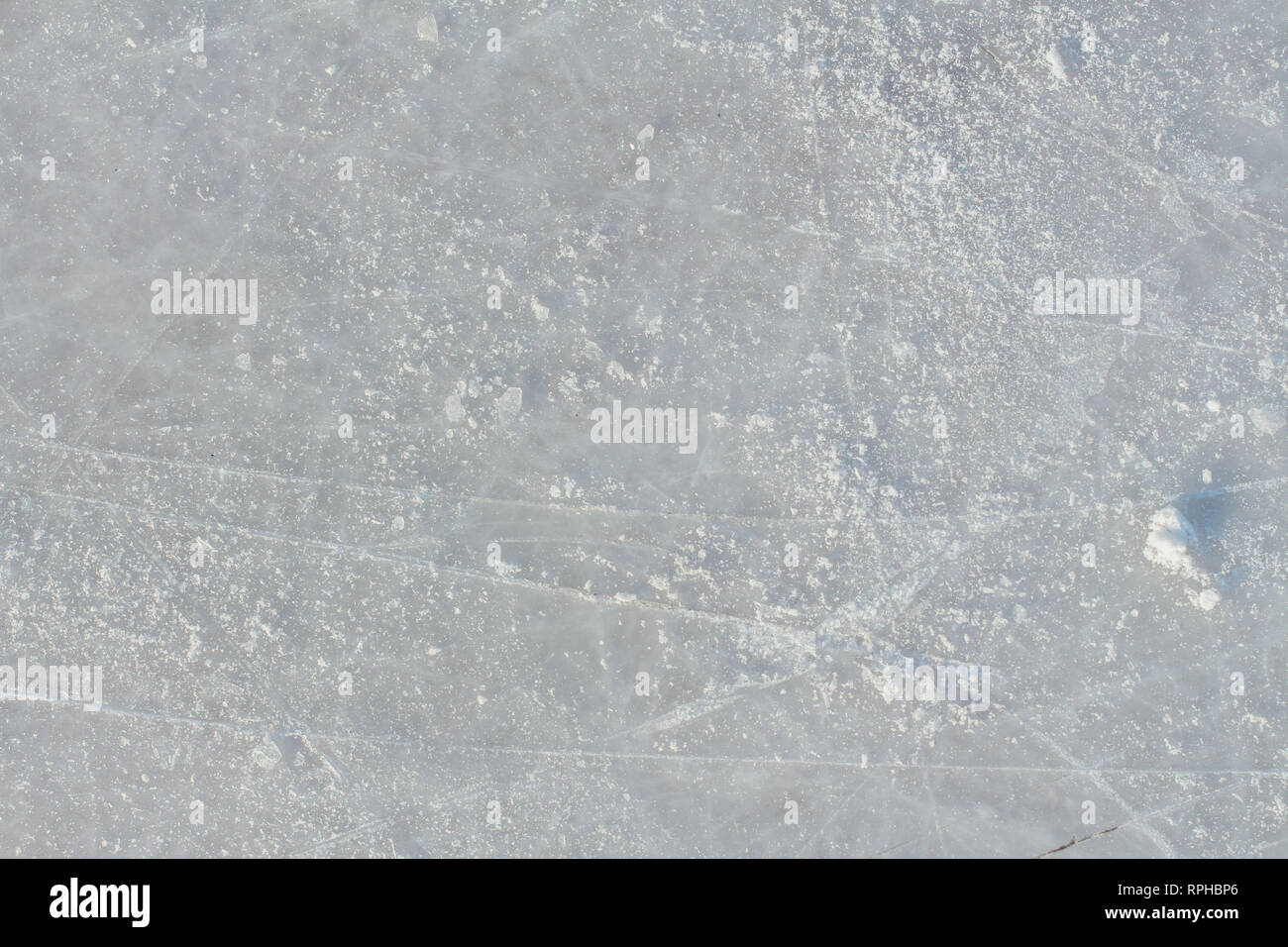 Ice background with marks from skating and hockey. Ice hockey rink