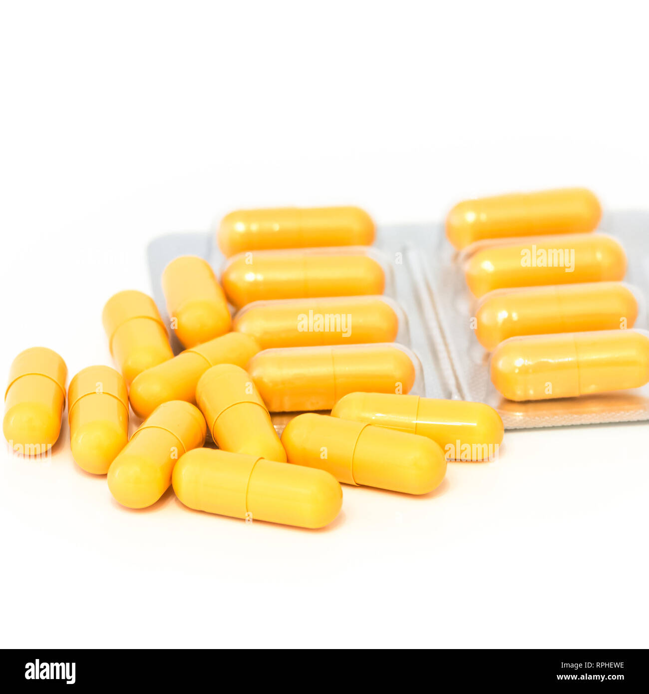 Download Bright Yellow Pills And Blisters Scattered On A White Background Isolated Stock Photo Alamy PSD Mockup Templates