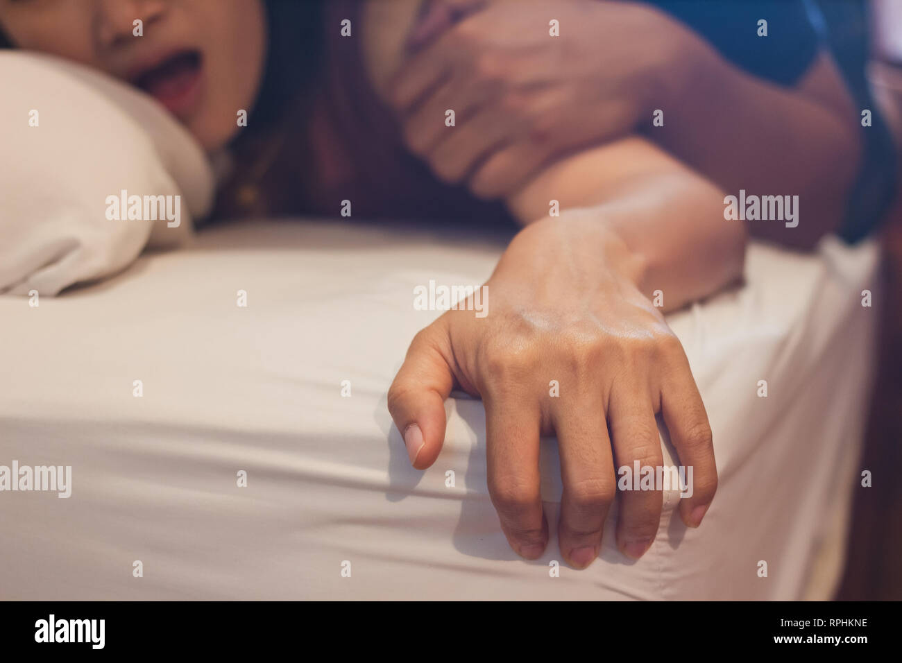 Soft focus on hands of passion couple having sex Stock Photo picture