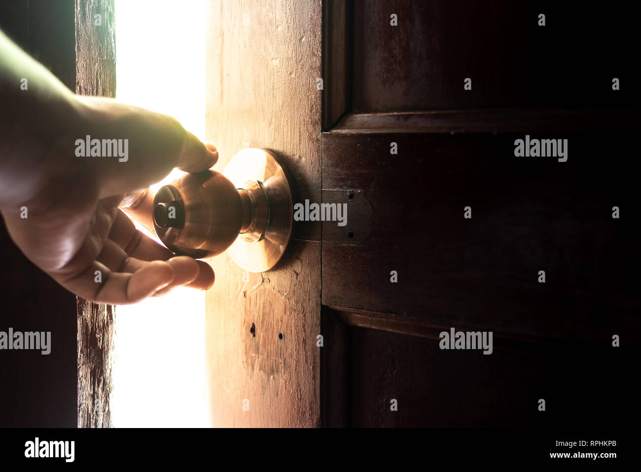 Use your hand to open the door to the light Stock Photo Alamy