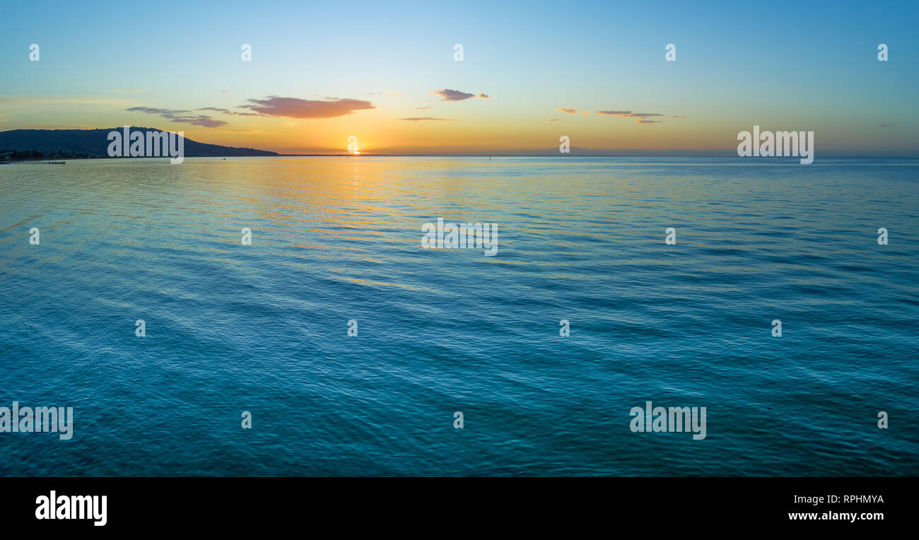 Water and land at dusk - minimalist aerial seascape panorama with copy space Stock Photo