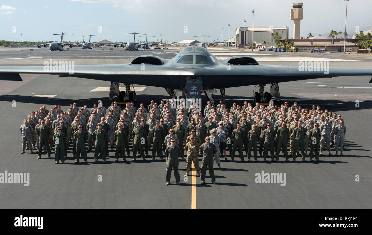 Airmen from Whiteman Air Force Base, Missouri, pose for photo during United States Strategic Command's Bomber Task Force mission at Joint Base Pearl Harbor-Hickam, Hawaii Jan. 30, 2018. Three B-2 Spirit Stealth Bombers and more than 200 Airmen were deployed here in support of U.S. Strategic Command’s Bomber Task Force (BTF) mission. During the BTF mission 37 sorties were flown for a total of 171 hours, 8 of the 37 inategrating the F-22 Raptor. (U.S. Air Force photo by Senior Airman Thomas Barley) Stock Photo