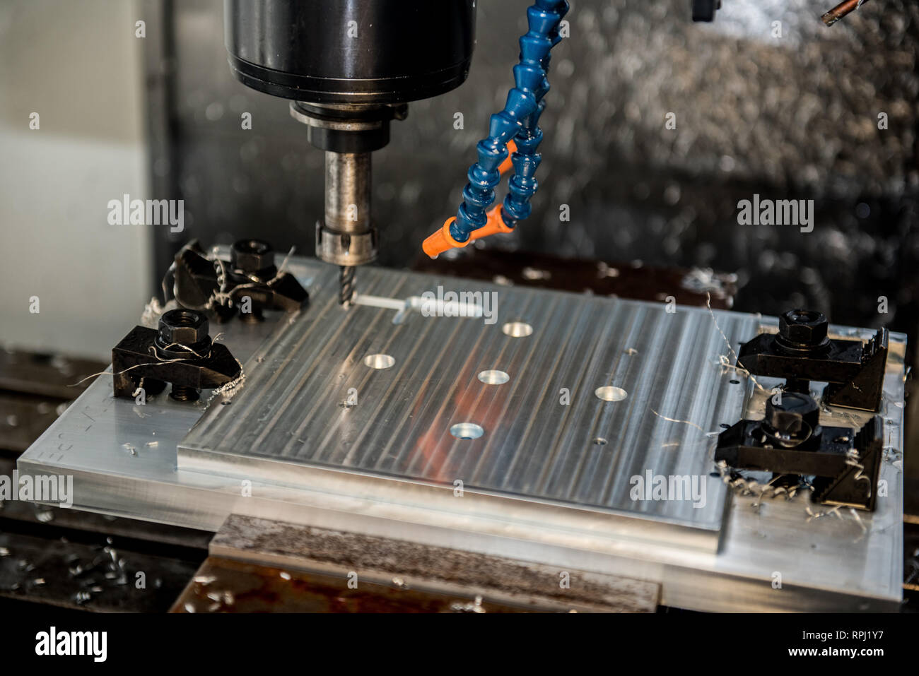 A vertical mill computer numeric control system drills into an aluminum plate at Dover Air Force Base, Delaware, Jan. 6, 2019. The 512th Airlift Wing volunteered to manufacture HH-60G Pave Hawk helicopter plates to assist the 920th Rescue Wing at Patrick AFB, Florida. (U.S. Air Force photo by Staff Sgt. Damien Taylor) Stock Photo