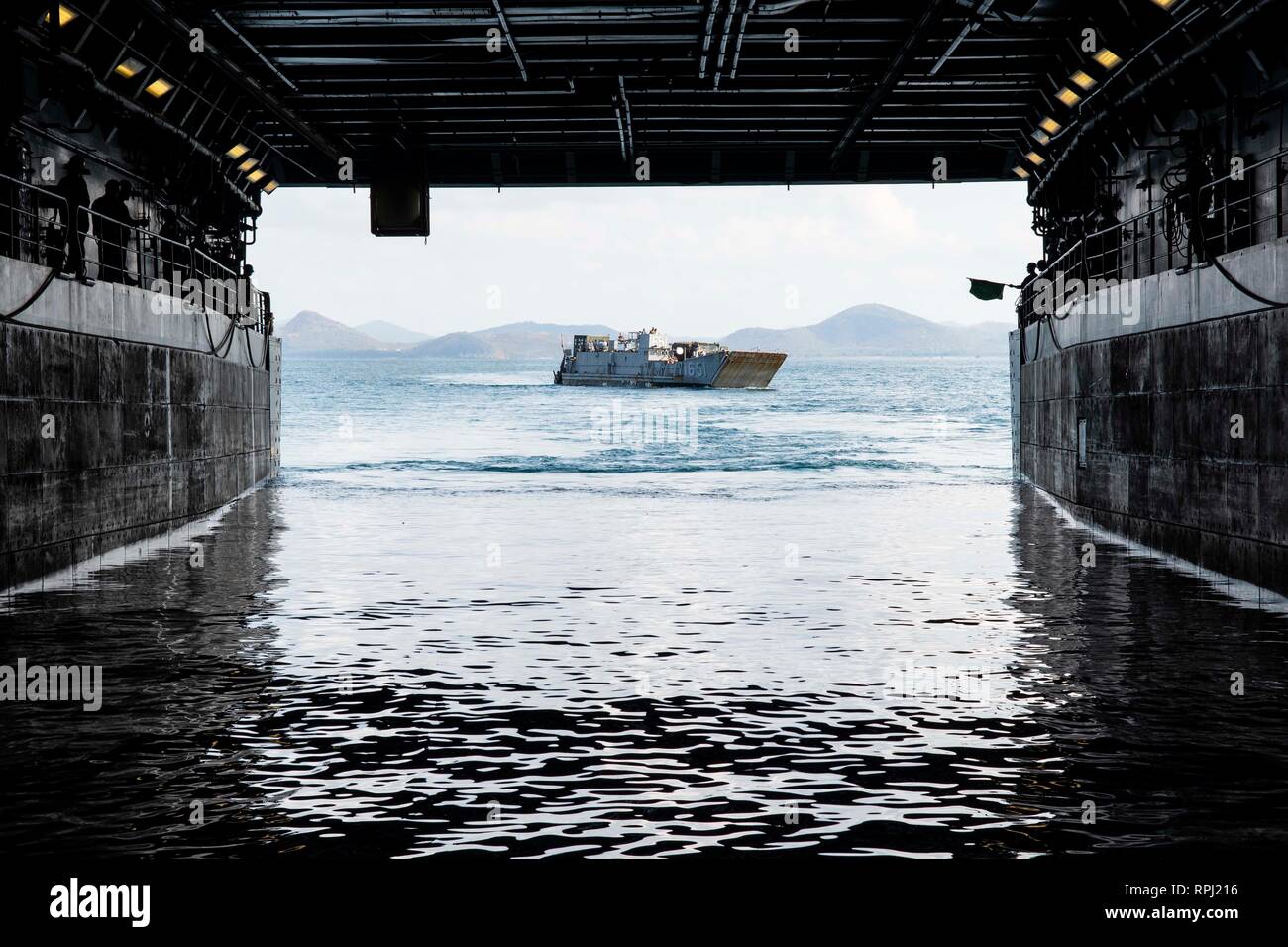 190221-N-DX072-1063 GULF OF THAILAND (Feb. 21, 2019) – Landing Craft, Utility (LCU) 1651, assigned to Naval Beach Unit (NBU) 7, approaches the well deck of the amphibious transport dock ship USS Green Bay (LPD 20). Green Bay, part of the Wasp Amphibious Ready Group, with embarked 31st Marine Expeditionary Unit (MEU), is in Thailand to participate in Exercise Cobra Gold 2019. Cobra Gold is a multinational exercise co-sponsored by Thailand and the United States that is designed to advance regional security and effective response to crisis contingencies through a robust multinational force to add Stock Photo