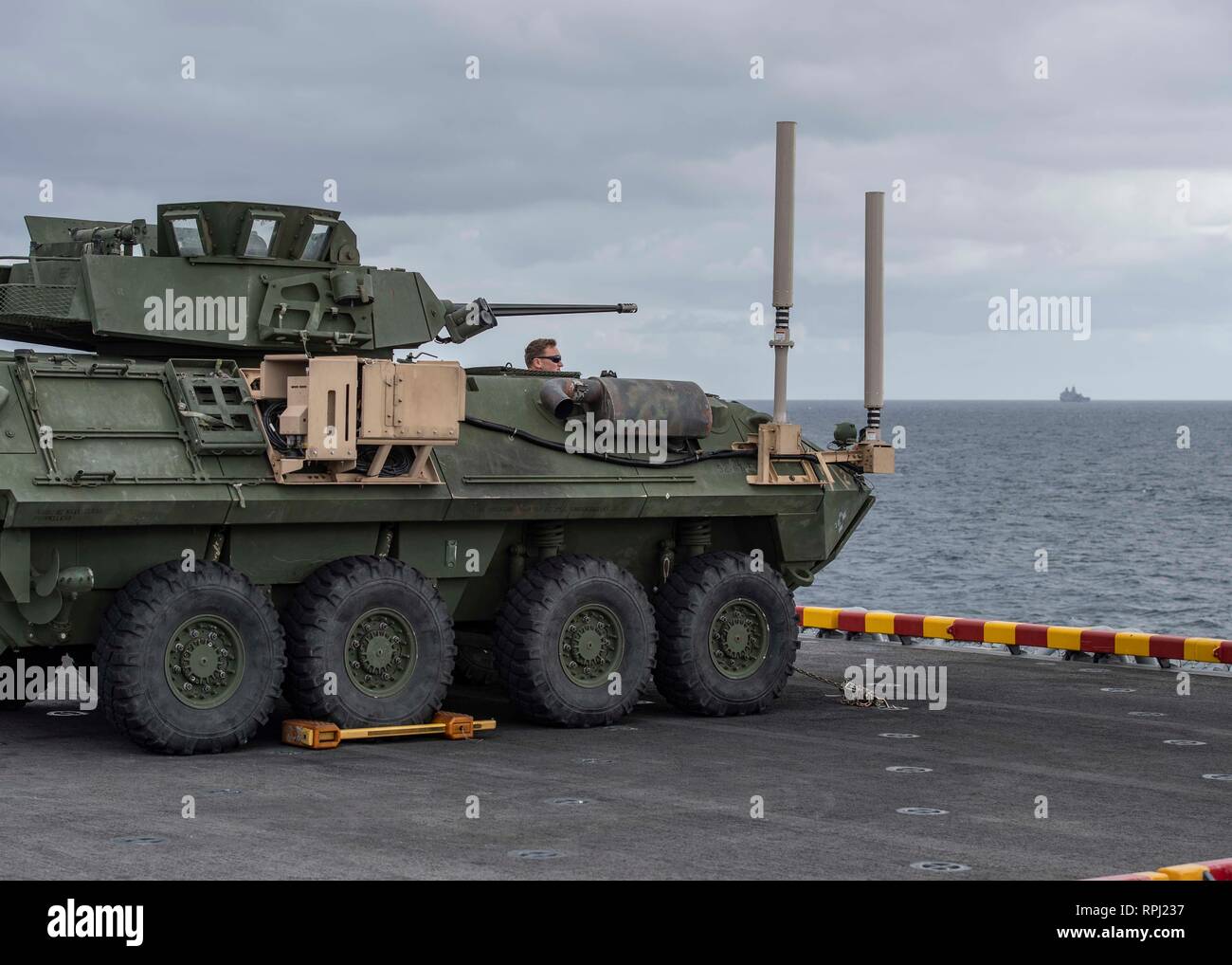 190220-N-PX867-1332 PACIFIC OCEAN (Feb. 20, 2019) U.S. Marine Corps Lance Cpl. Nathan Barnes, from Dorsey, Ill., assigned to 11th Marine Expeditionary Unit (MEU), sits in a light armored vehicle (LAV) on the flight deck of amphibious assault ship USS Boxer (LHD 4). Boxer is underway conducting routine operations as a part of USS Boxer Amphibious Ready Group (ARG) in the eastern Pacific Ocean. (U.S. Navy photo by Mass Communication Specialist 3rd Class Justin Whitley) Stock Photo