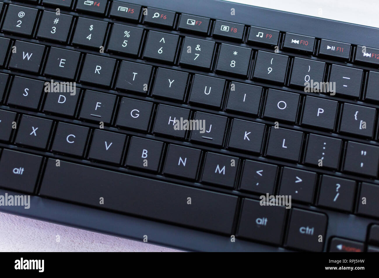 Modern black computer keyboard with flat keys Stock Photo Alamy