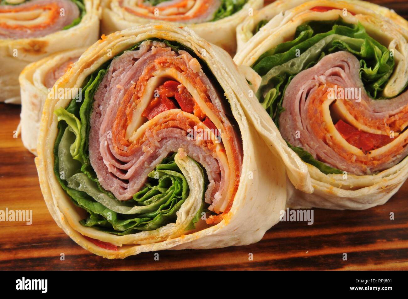 Closeup of a wrap sandwich with salami, pepperoni, and cheeses Stock Photo Alamy