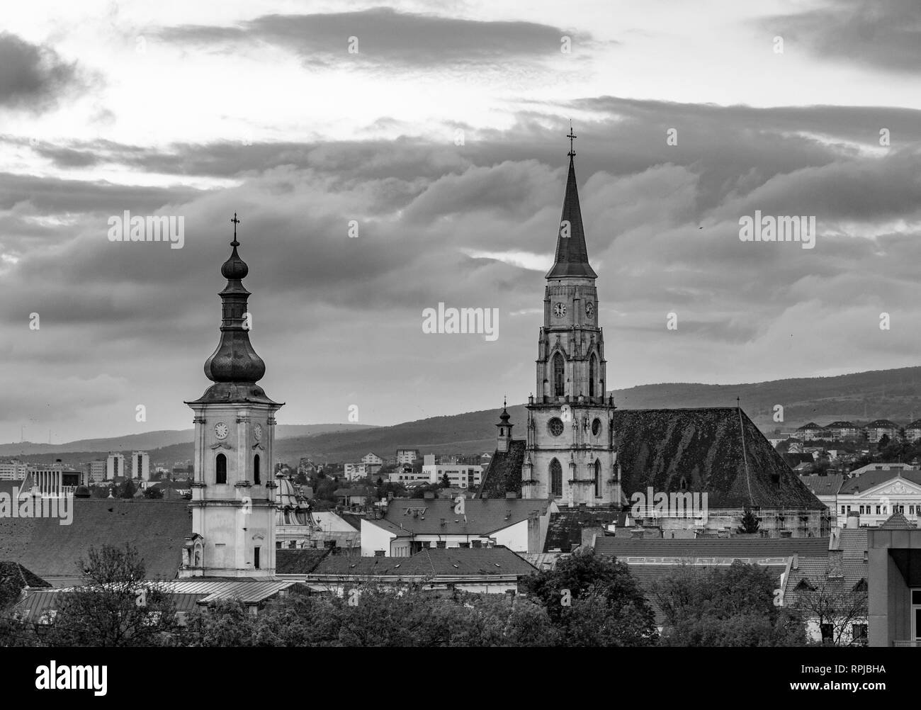 The Franciscan Church and St. Michael's Church black and white photo in Cluj-Napoca, Romania. Stock Photo