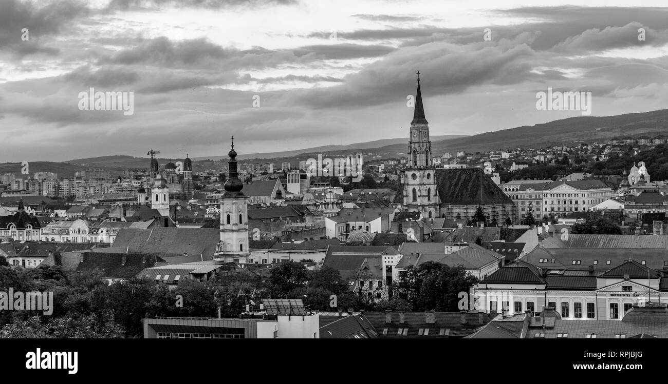 The Franciscan Church and St. Michael's Church black and white photo in Cluj-Napoca, Romania Stock Photo
