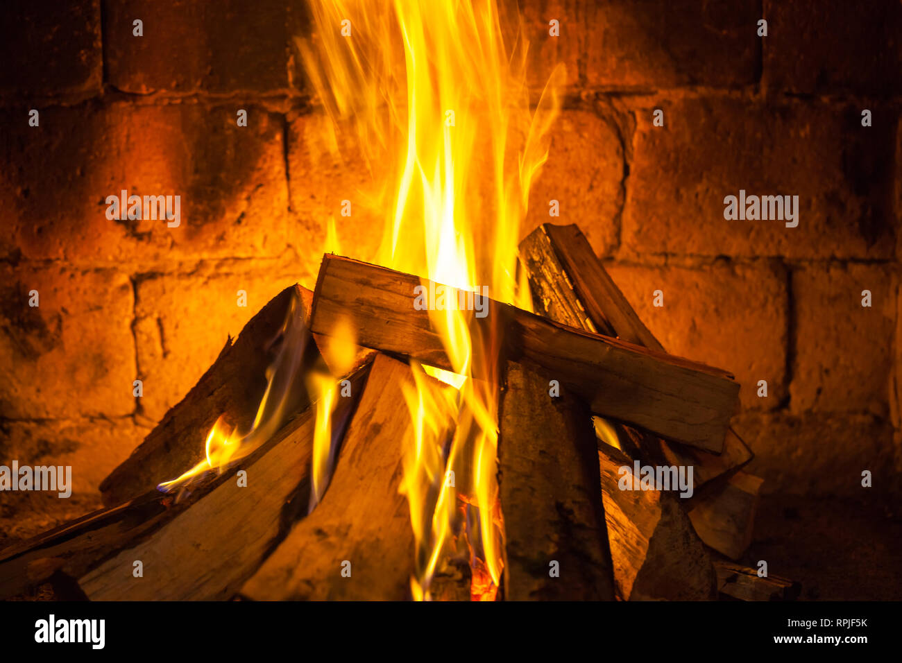 Wood Burning In A Cozy Fireplace At Home Keep Warm Stock Photo