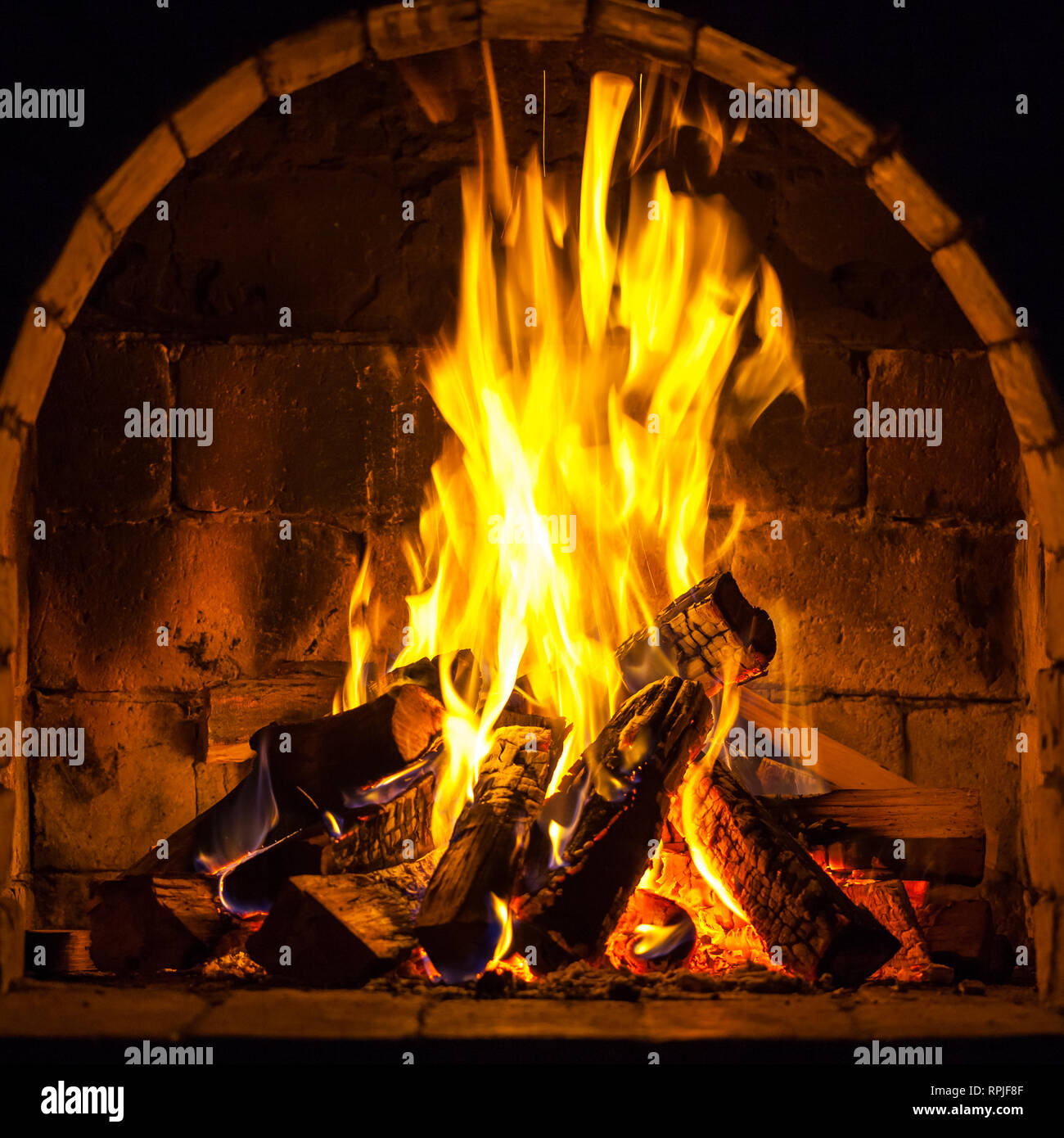 Wood Burning In A Cozy Fireplace At Home Keep Warm Stock Photo