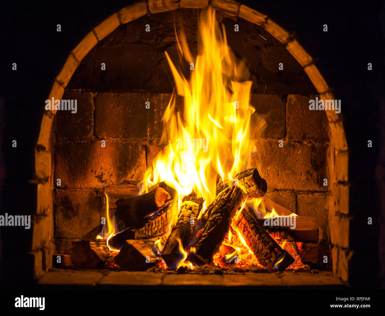 Wood Burning In A Cozy Fireplace At Home Keep Warm Stock Photo