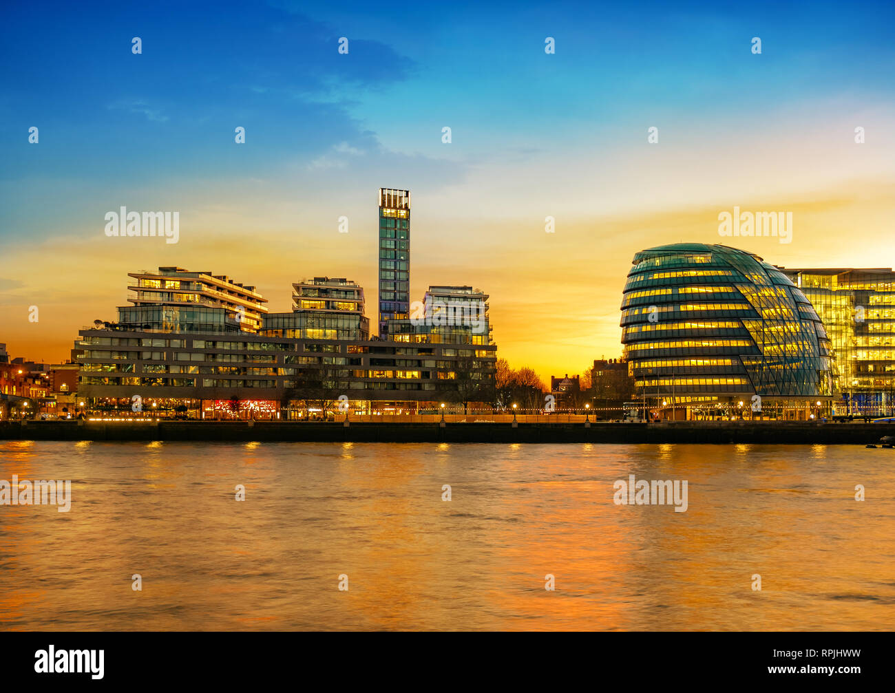 Beautiful landscape of London City in sunset light, Cityscape and skyline over the Thames river and World Trade buildings in UK Stock Photo