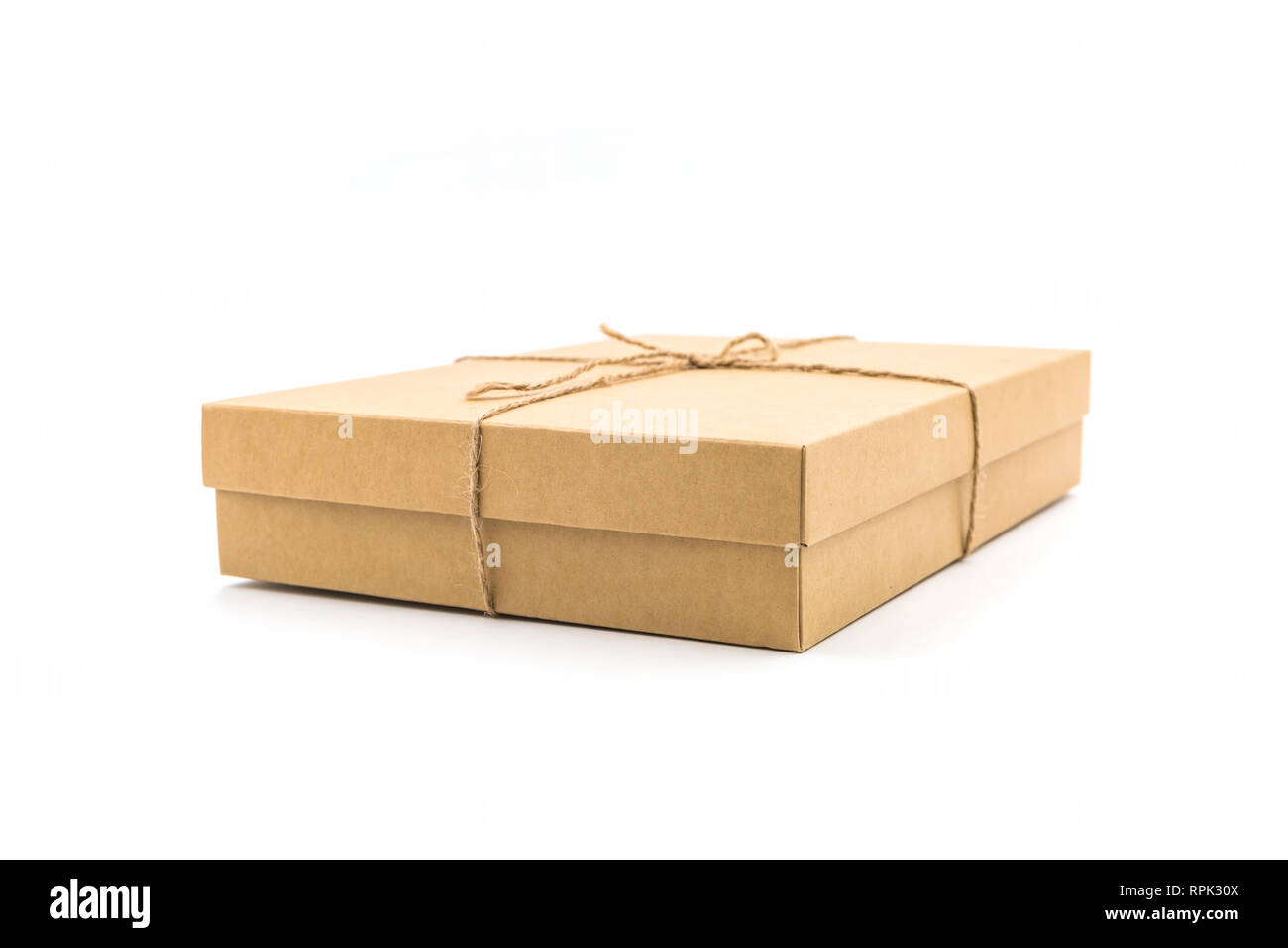 String Paper Box Brown paper box, tied with string on white background Stock Photo - Alamy