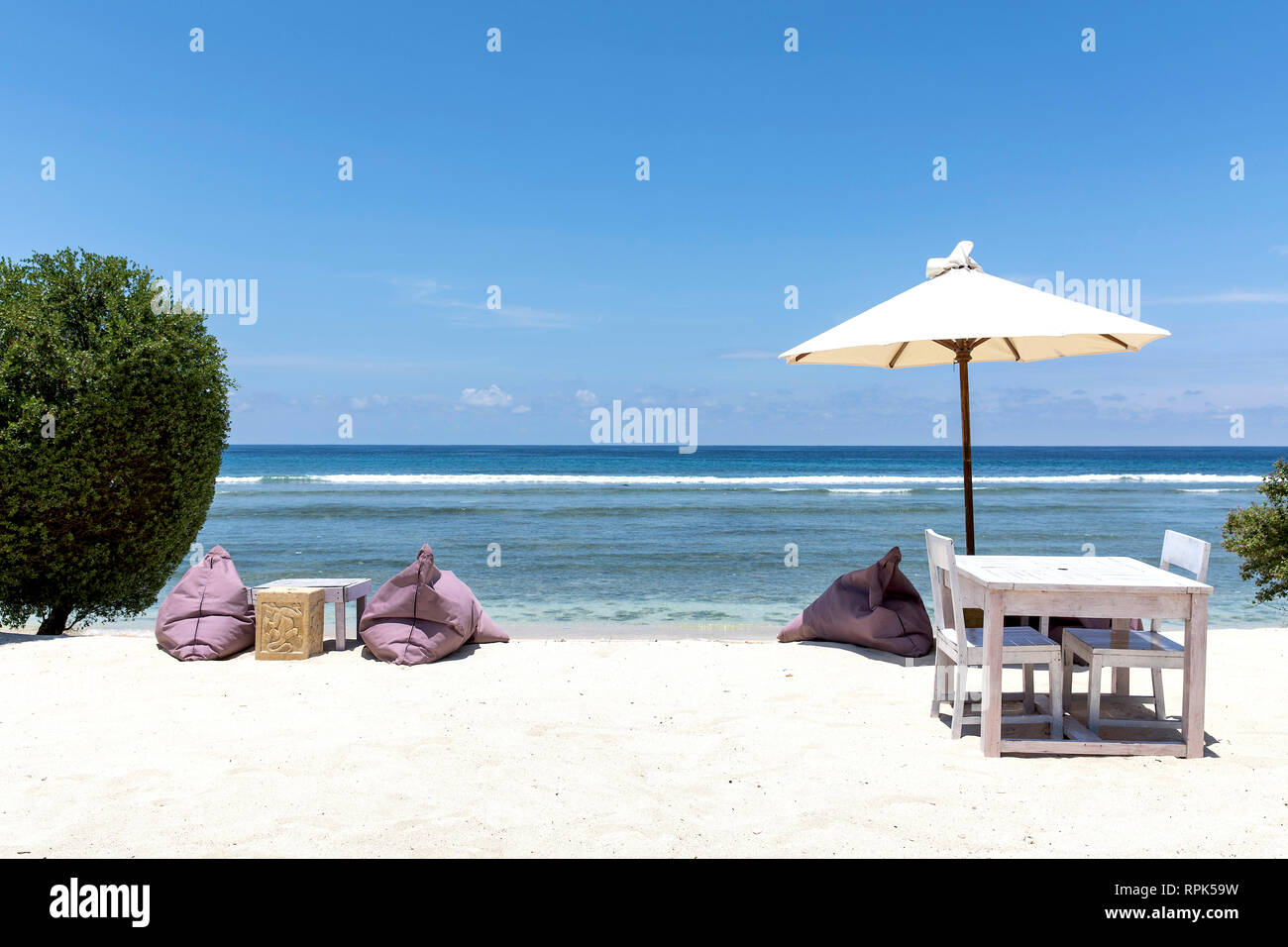 Colorful sunbeds on the beach of Gili Trawangan island, Indonesia. Stock Photo