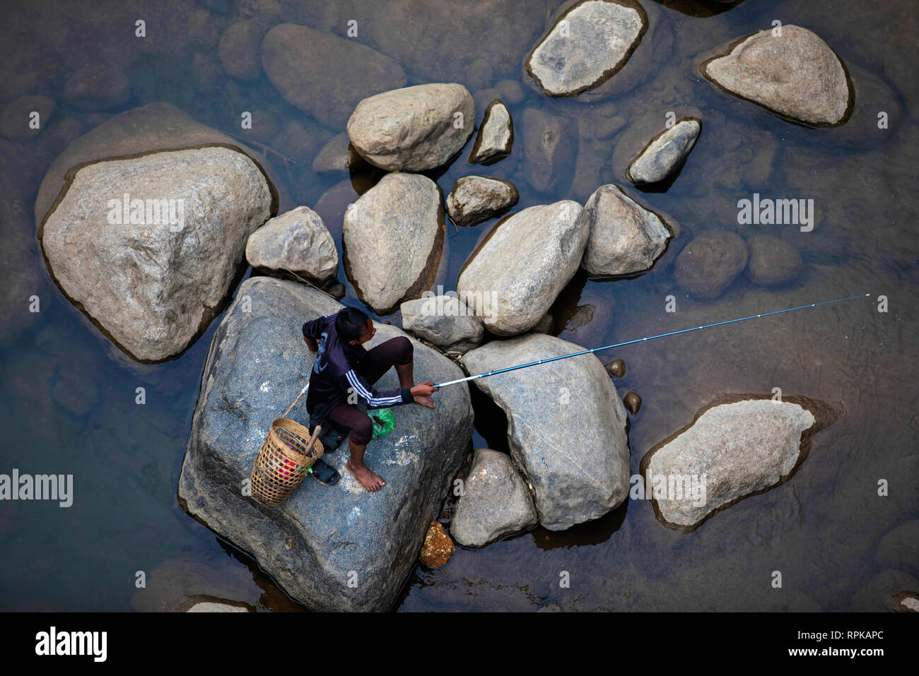 MEGHALAYA, INDIA, September 2018, Fisherman fishing at Umngot River, Dawki Stock Photo