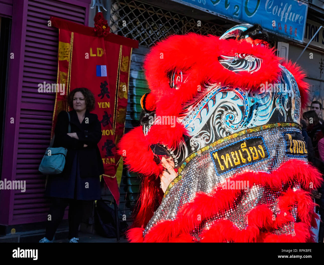 PARIS, FRANCE - FEBRUARY 17, 2019. Last day of the chinese new year celebration festival in street. Dance of colorful lions decoration masks in the st Stock Photo