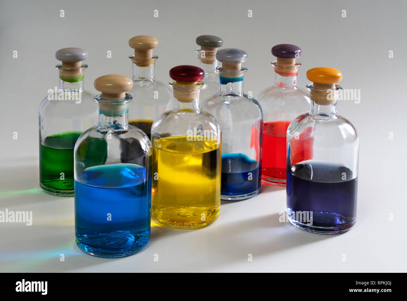 Small glass bottles containing colored liquid Stock Photo