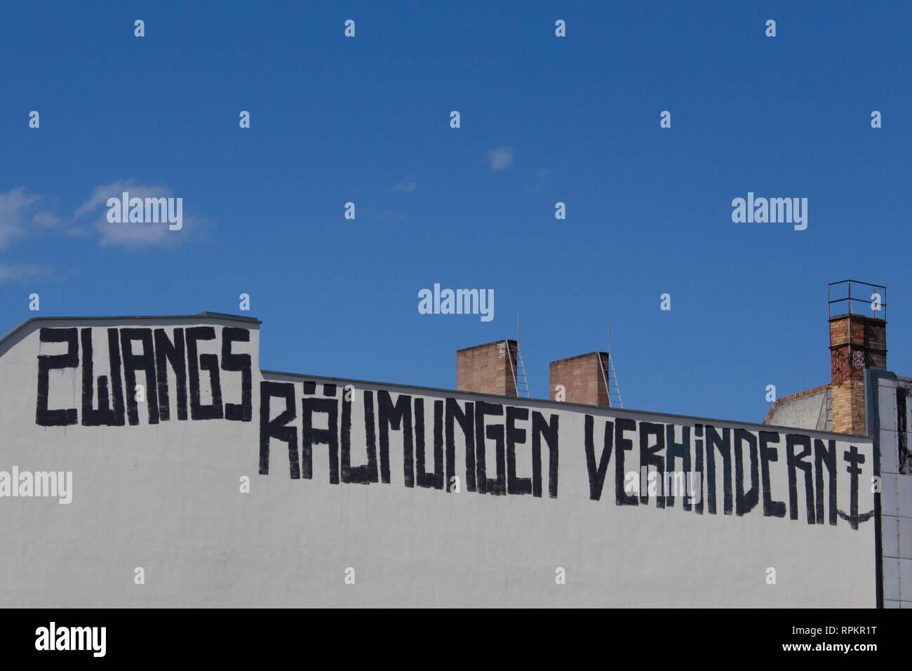 Berlin, Germany - June 14, 2016: 'Stop evictions' (german: Zwangsraeumung verhindern) graffiti on building facade in Berlin, Germany. Stock Photo