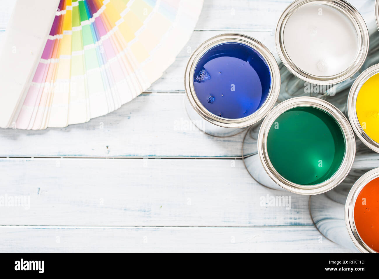 Top of view paint cans brushes and color palette on table Stock Photo ...