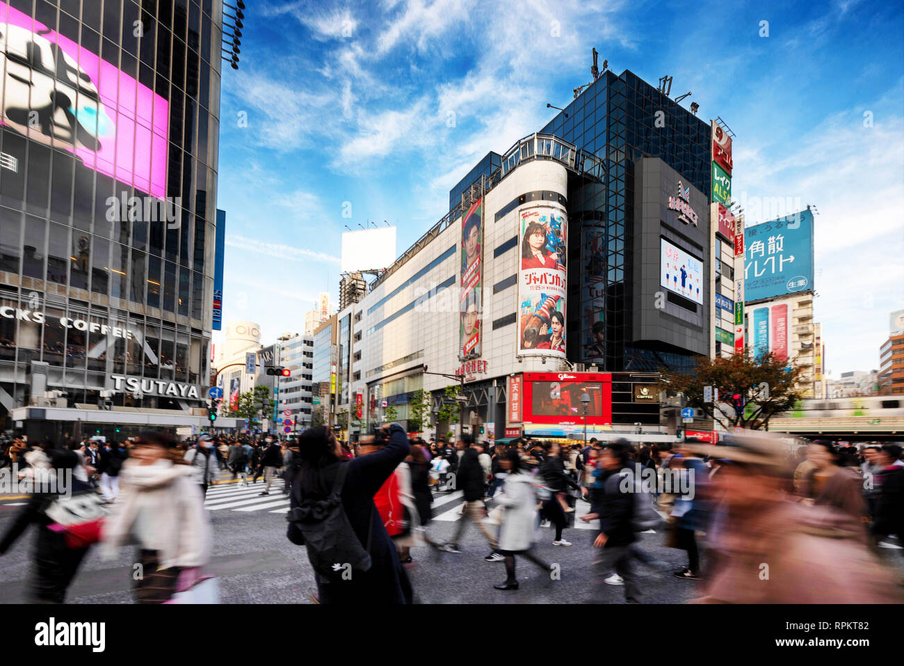 TOKYO, JAPAN - NOV 25:  Slow exposure of pedestrians, cars and buses at Shibuya Crossing on November 25, 2018. The crossing is regarded as the world's Stock Photo