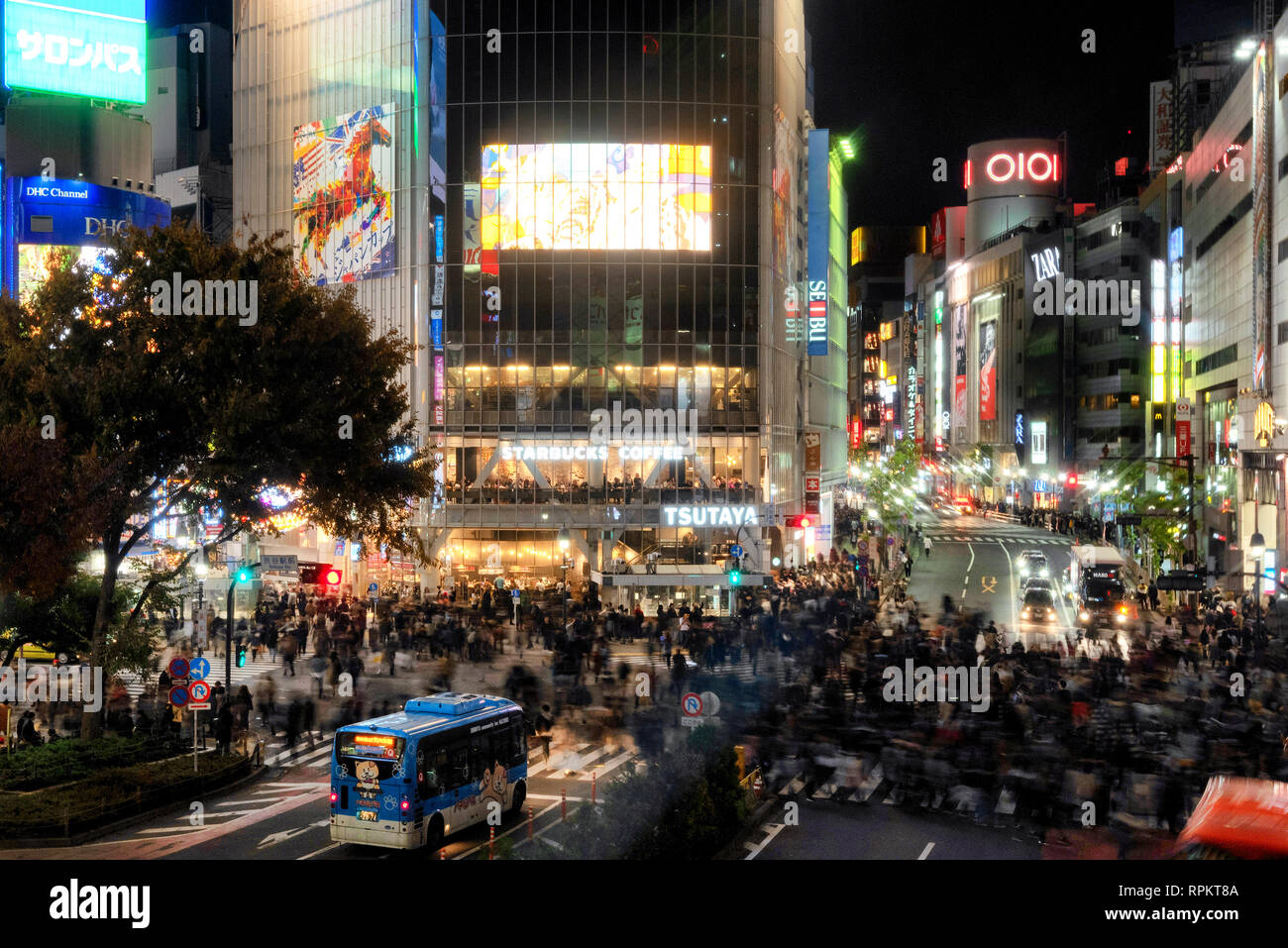 Slow exposure image of Shibuya Crossing in Tokyo, Japan as pedestrians cross the intersection Stock Photo