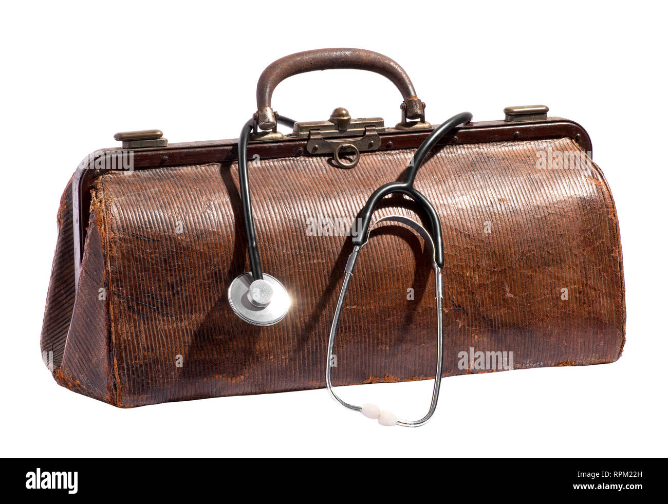 Old vintage leather doctors bag with stethoscope dangling over the side over white in a healthcare and medical concept Stock Photo