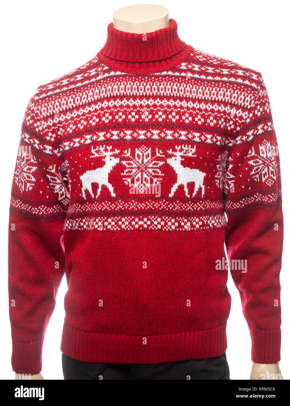 Red knitted Christmas turtleneck sweater of traditional design with moose or elk ornament on a mannequin isolated on a white background Stock Photo