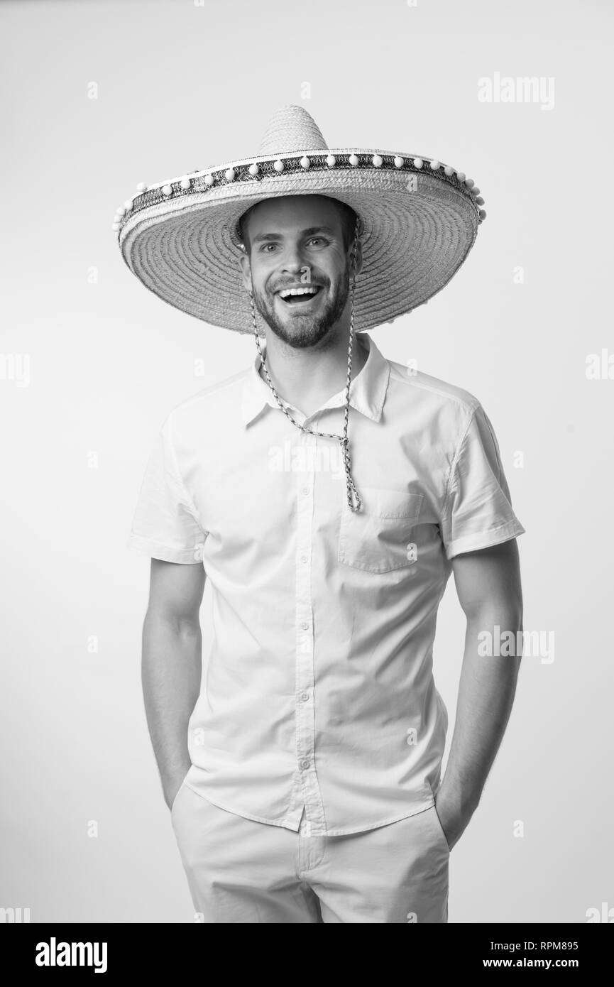 Happy man smile in sombrero hat isolated on white background, fashion. Always in good mood. Mexican style. Travel concept. Handsome and stylish. Confidence and charisma, black and white. Stock Photo