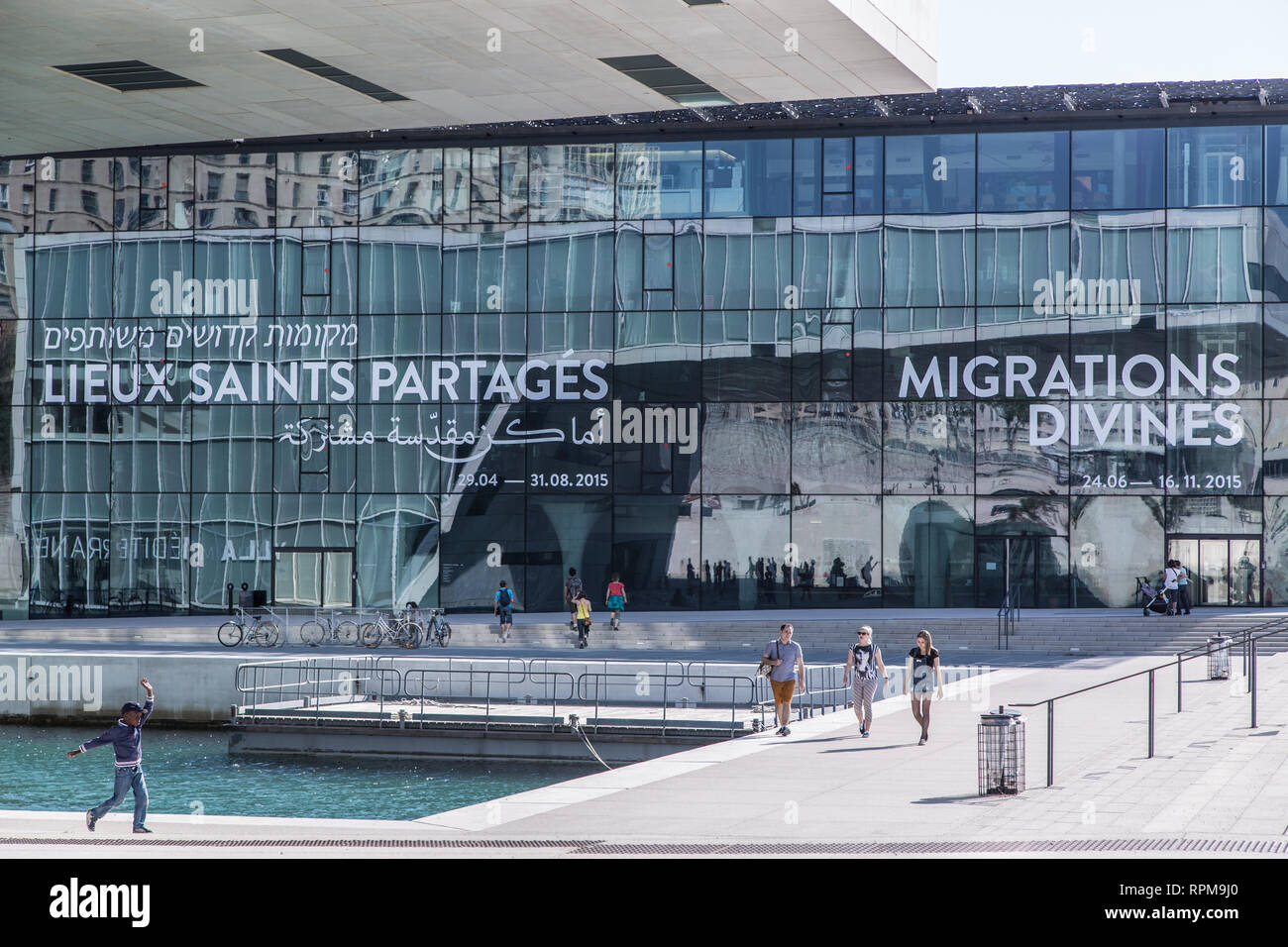 The reflection of the Villa Méditerranée on a warm summer day in the glass window wall of the MUCEM in Marseille, France. Stock Photo