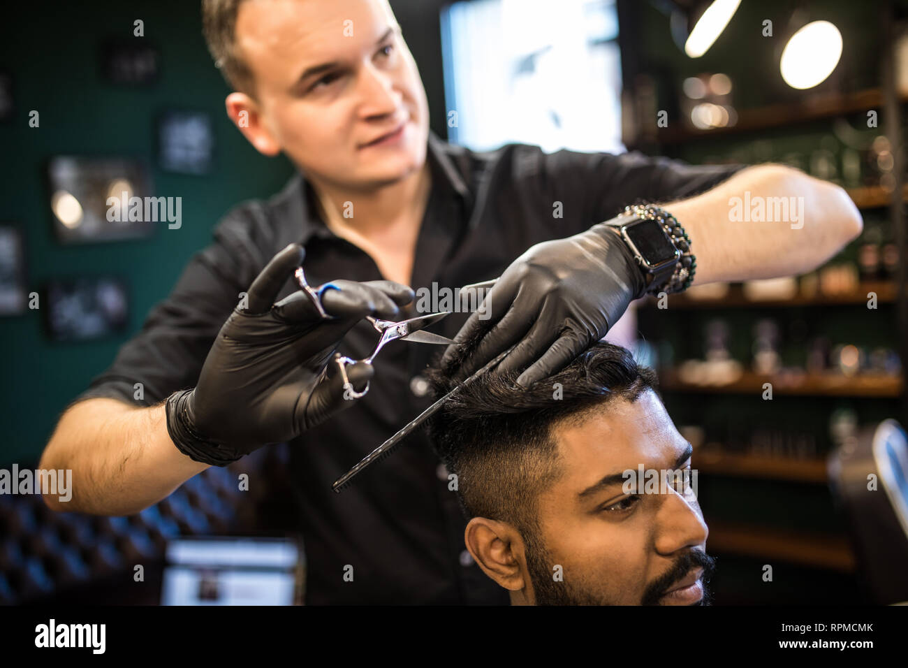 Close Up Of Man Getting Trendy Haircut At Barber Shop Male