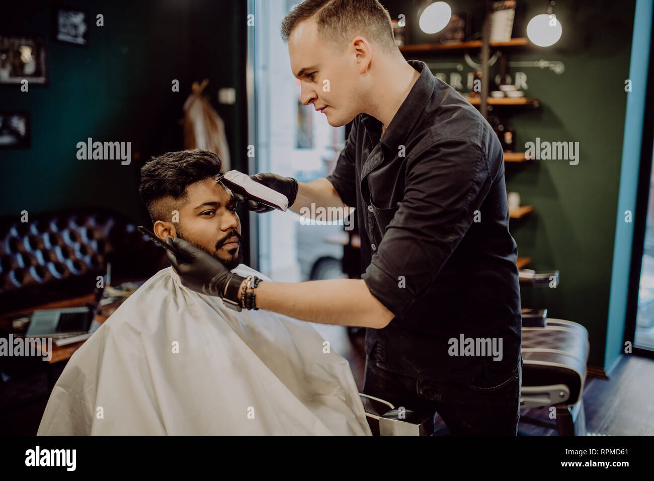 Premium Photo  Haircut men barbershop. men's hairdressers barbers. barber  cuts the client machine for haircuts.