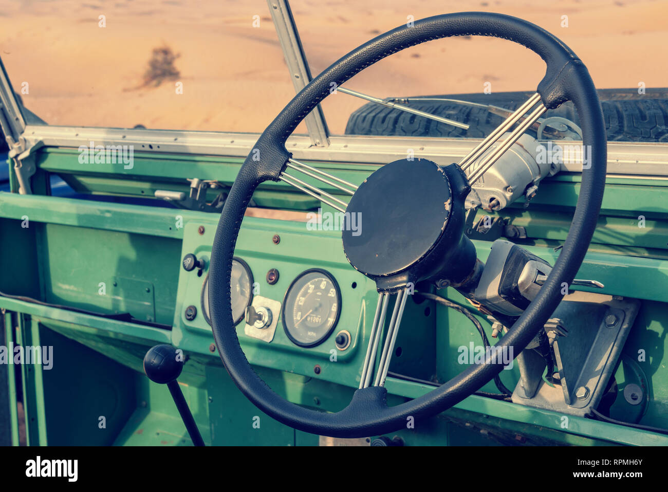 Inside of a vintage open top green 4x4 SUV Stock Photo