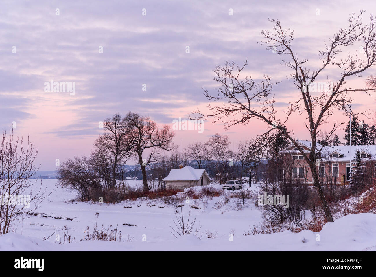 A lakefront house by icy shore of Lake Superior in winter. Duluth, Minnesota, USA Stock Photo