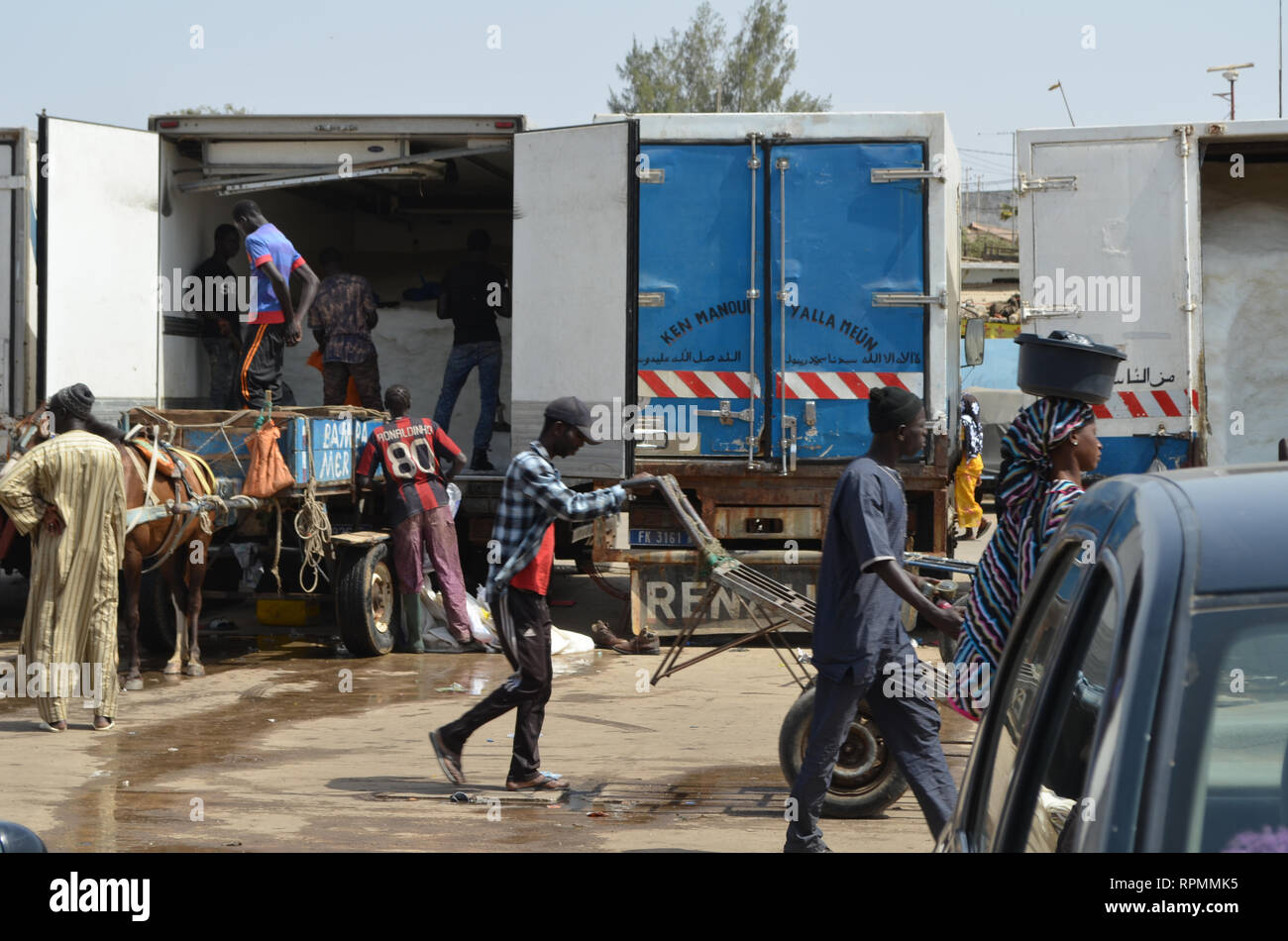 Trucks at the parking lot of Mbour fish market Stock Photo Alamy