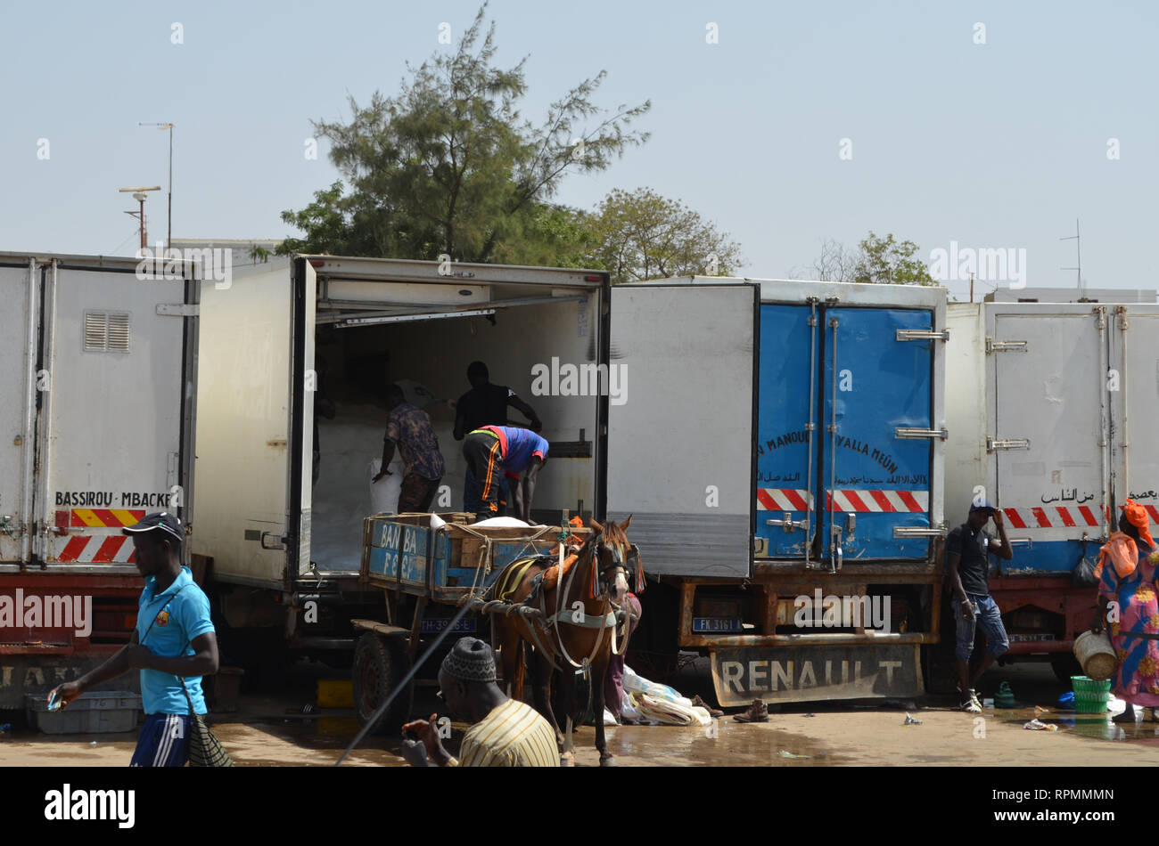 Trucks at the parking lot of Mbour fish market Stock Photo Alamy