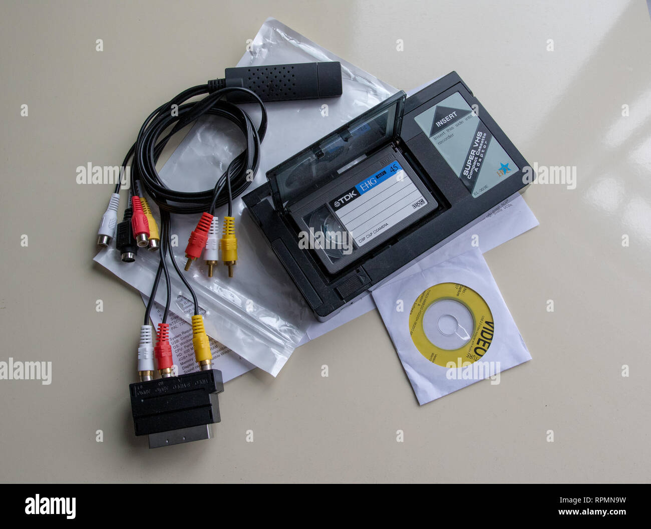 VHS-C adaptor and cheap analogue video digitiser Stock Photo - Alamy