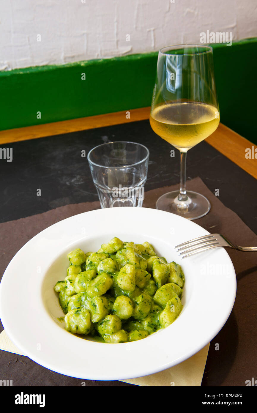 Gnocchi al pesto, a traditional Genoese recipe, is one of the dishes on offer at il Genovese restaurant in Genoa. Stock Photo