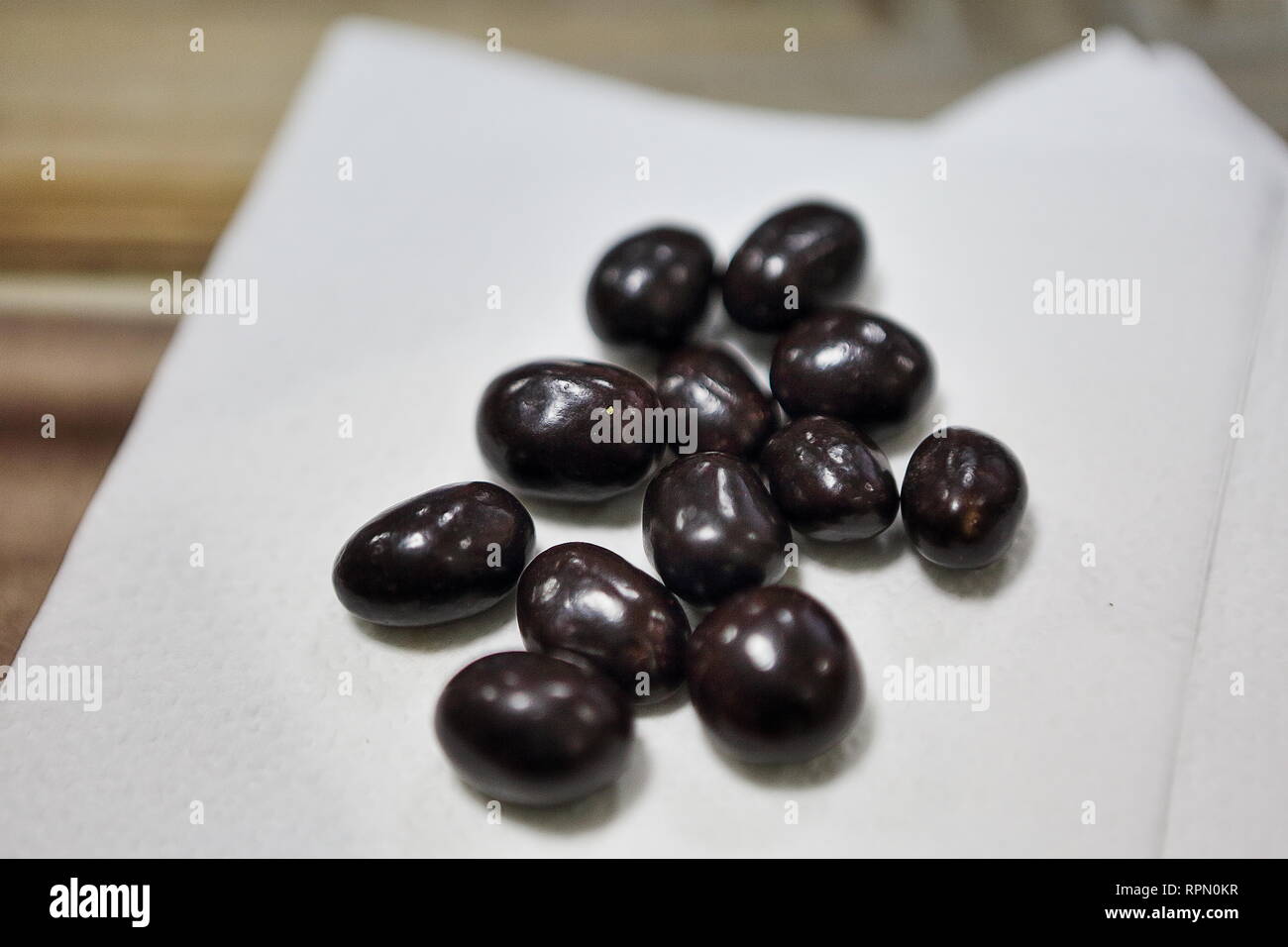 Peanuts in chocolate icing produced by Roshen factory owned by Ukraine's 5th President Petro Poroshenko, - a simple and much desired treat in Ukraine. Stock Photo