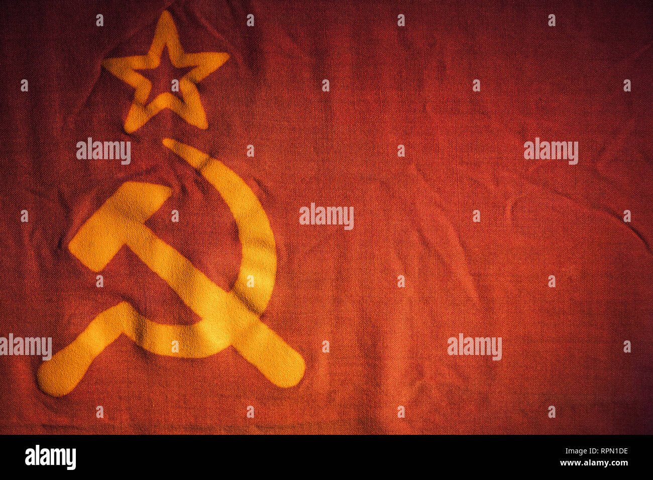 Soviet Union flag fragment with star, hammer and sickle Stock Photo
