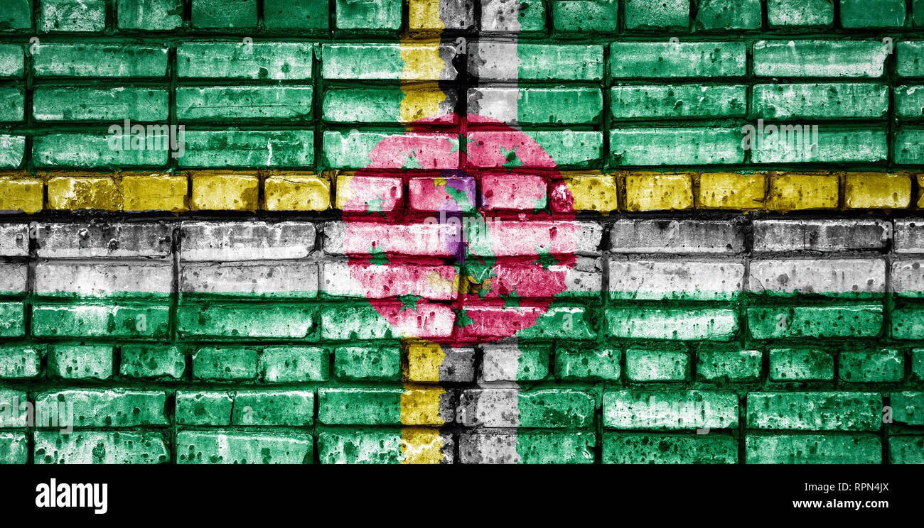 National flag of Dominica on a brick background. Concept image for ...