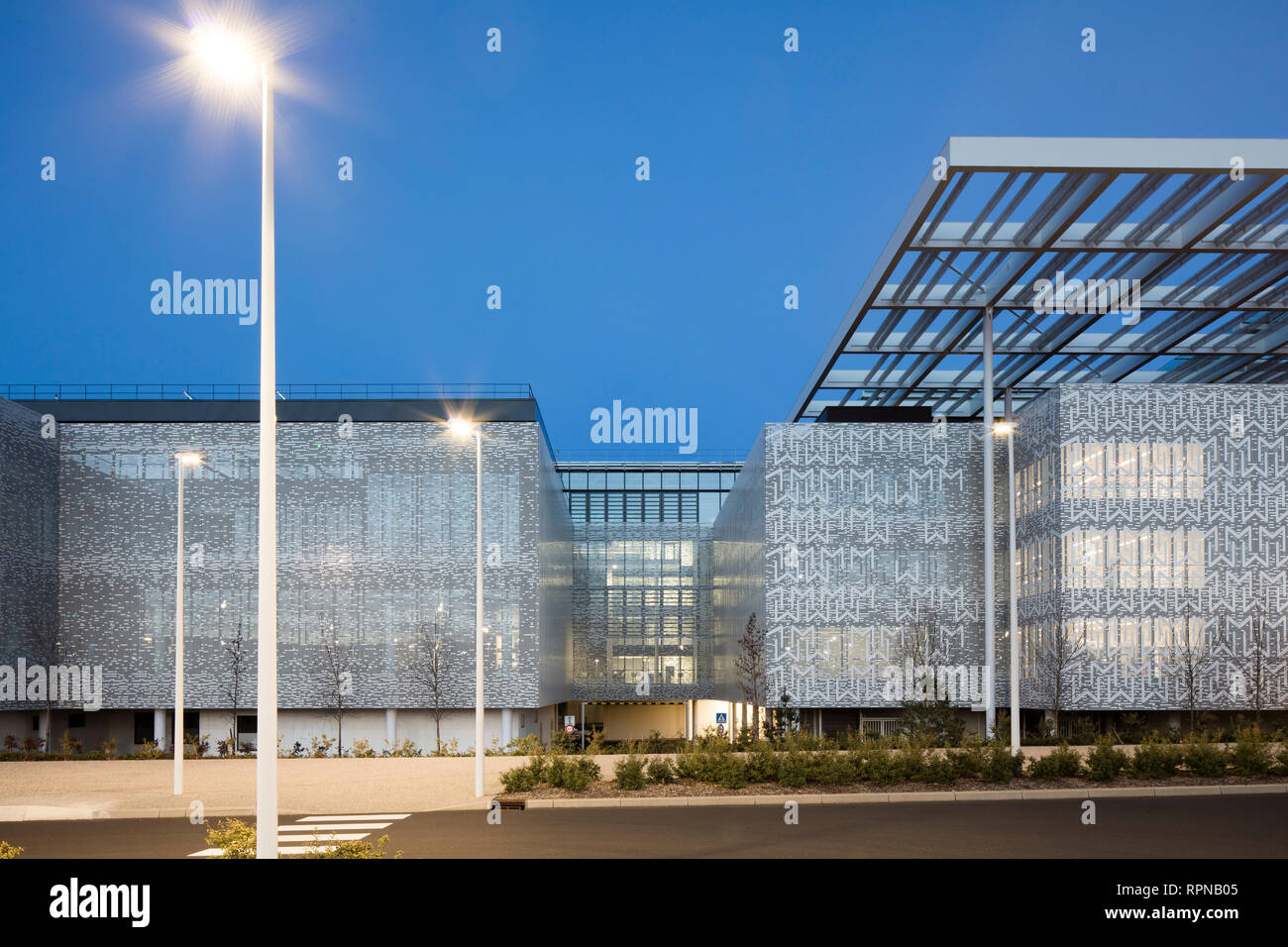 Exterior facade elevation at dusk. Research Centre of the Urbalad