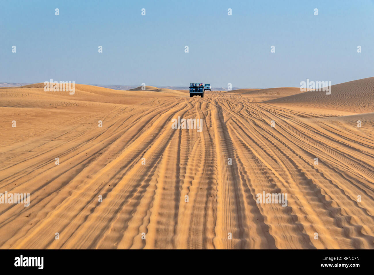 Vintage open top 4x4 SUV in the desert in Dubai, United Arab Emirates Stock Photo