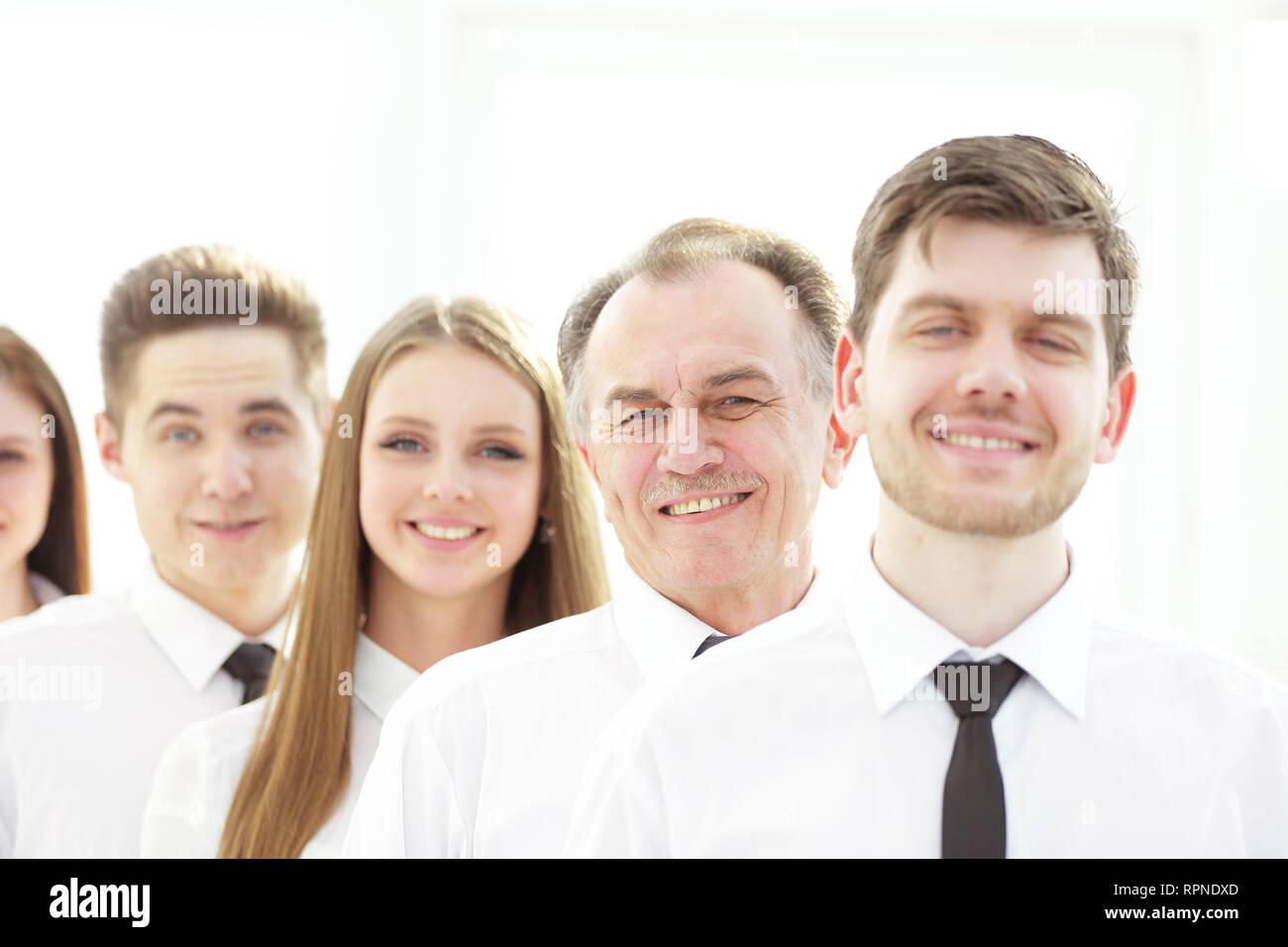 close up. a successful group of employees standing in a row Stock Photo ...