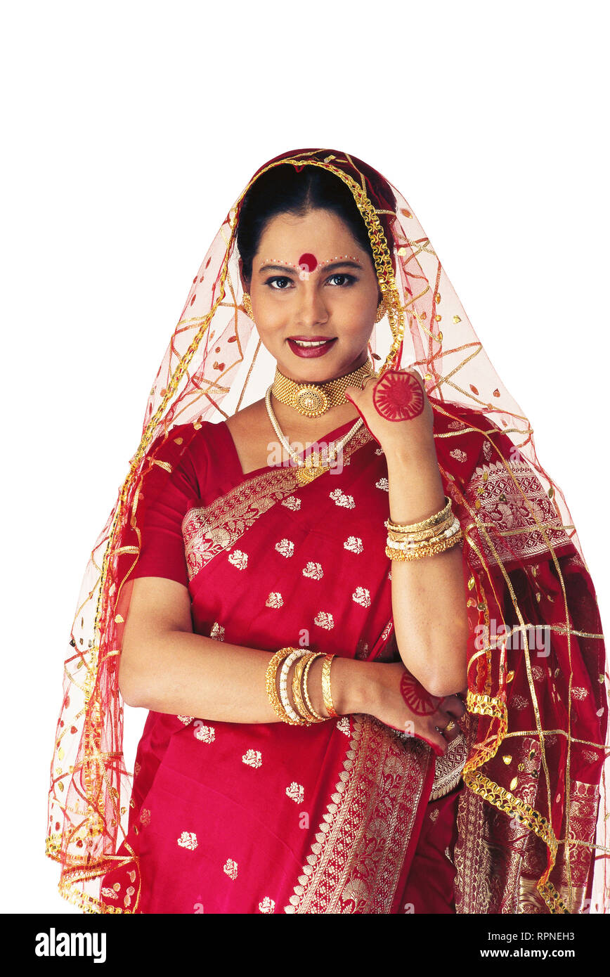 A PORTRAIT OF A BENGALI Bride dressed in traditional SAREE AND ...