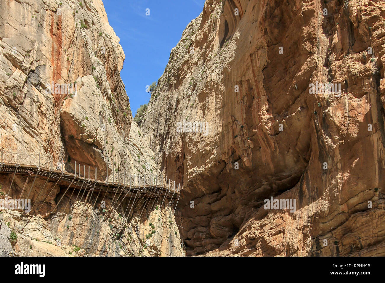Caminito del Rey (The King's Little Path) is a walkway, pinned along the steep walls in the  Desfiladero de los Gaitanes (Gaitanes Ravine) Stock Photo