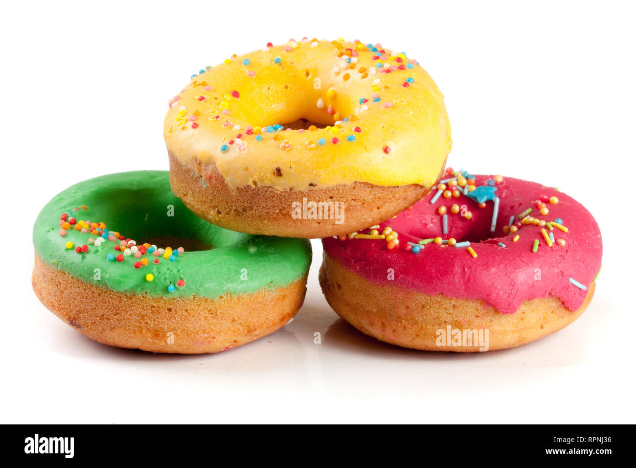 three glazed donut isolated on white background Stock Photo - Alamy