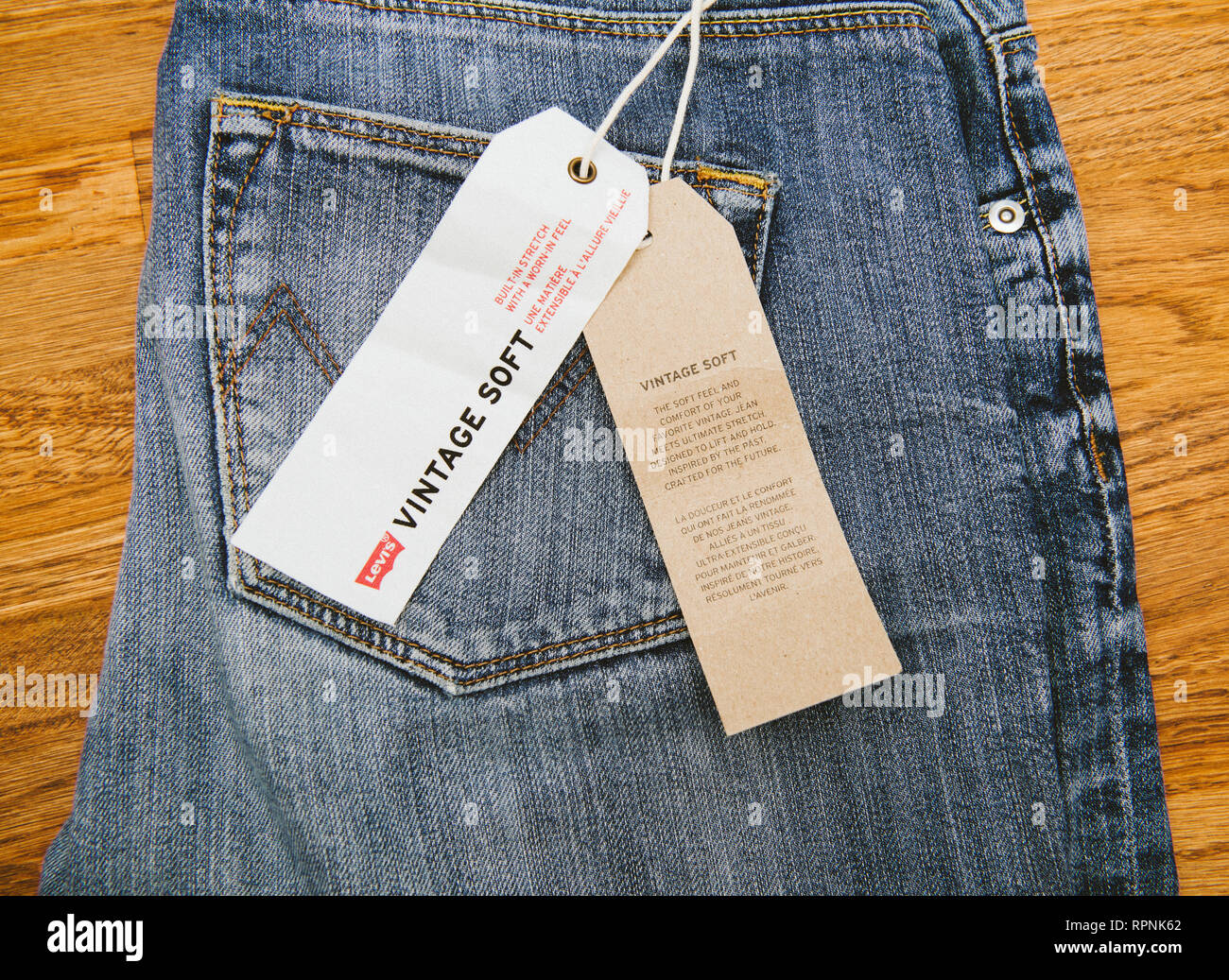 PARIS, FRANCE - JAN 2, 2018: New Jeans with price tag manufactured by the  Levi's placed on natural wooden table - model Vintage Soft Stock Photo -  Alamy