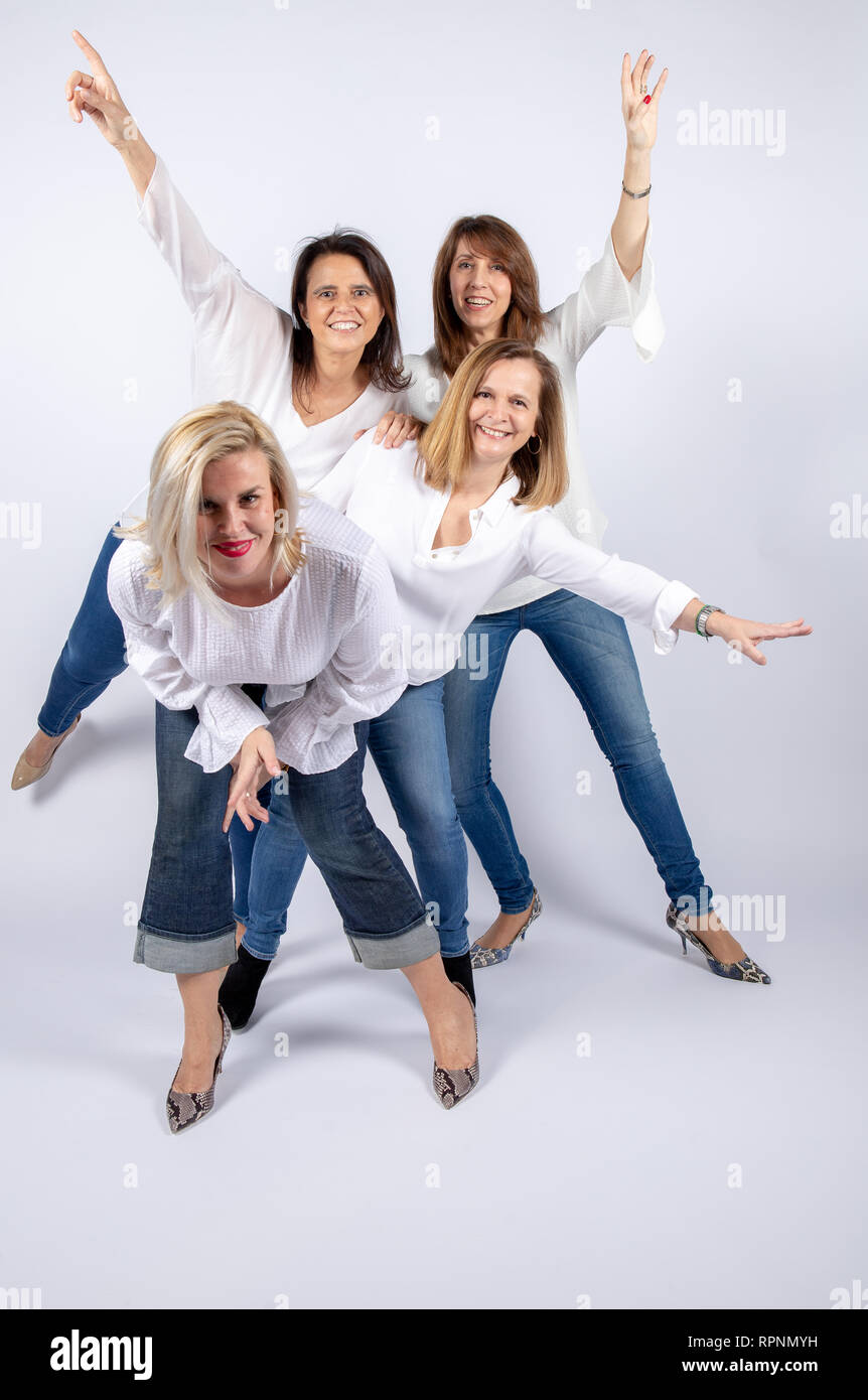 Group of 4 women, friends, middle-aged having fun in a photo ...